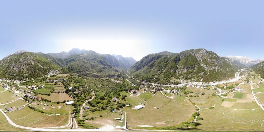 Aerial view of Theth village in the Albanian Alps, accessible via the fully paved SH21 road from Shkoder.